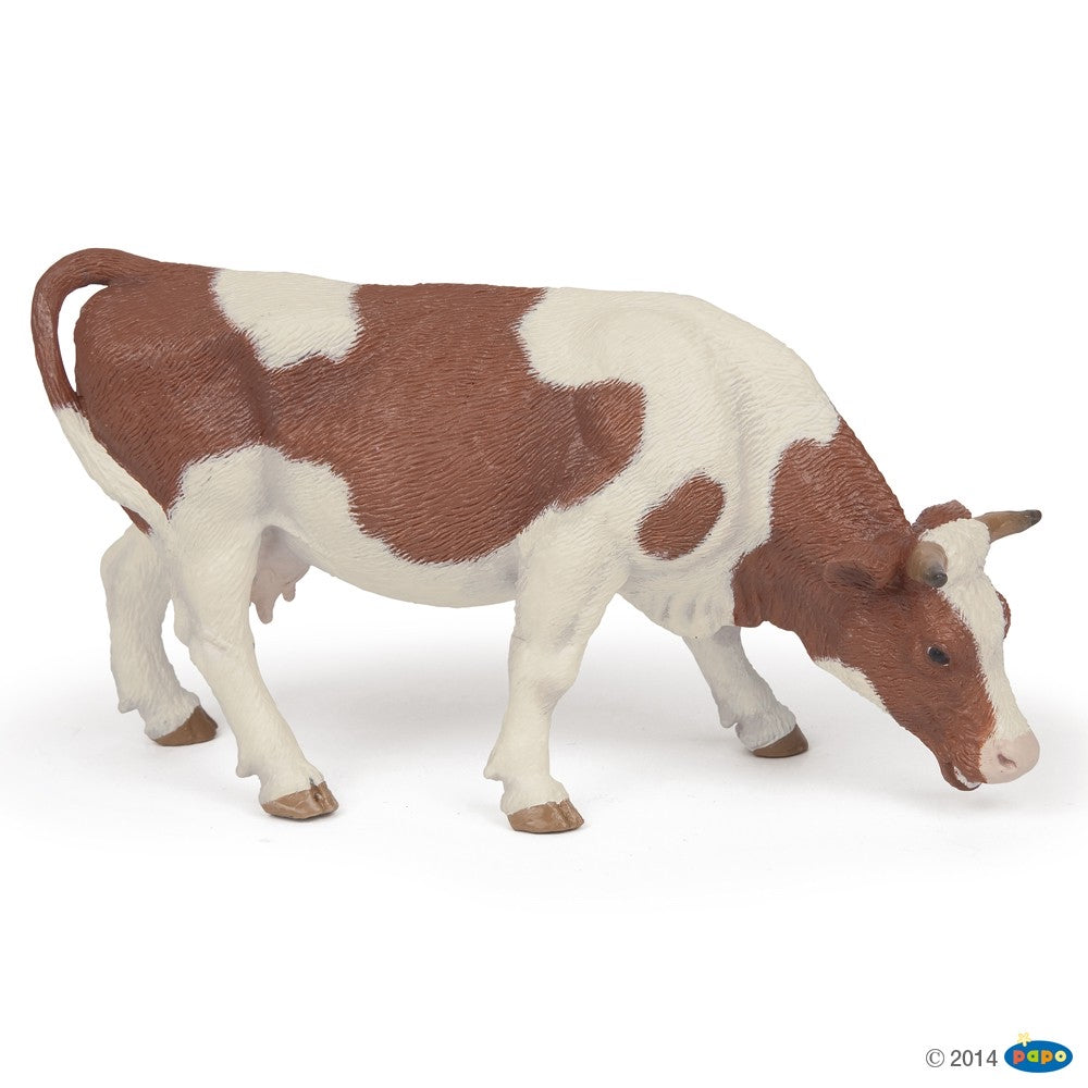 SIMMENTAL COW GRAZING FIGURINE