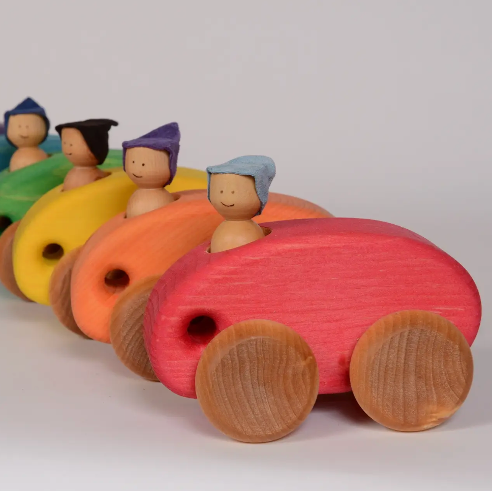 OVAL WOODEN CAR WITH FIGURE