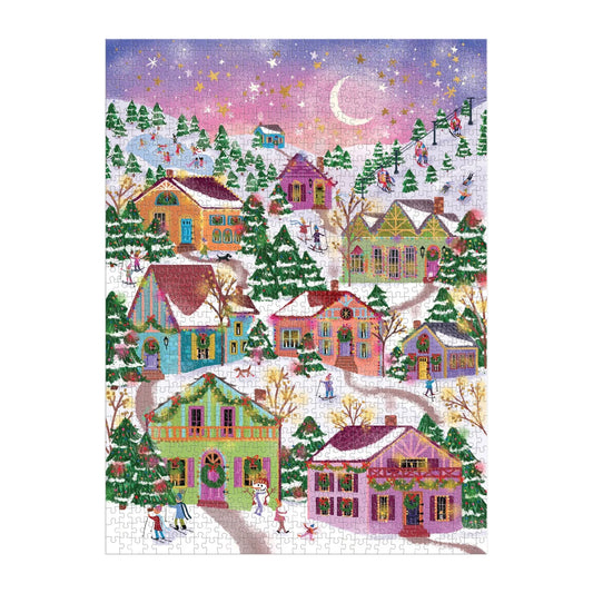 Casse-tête de 1000 pièces Snowcap Village Galison assemblé, montrant un paysage hivernal féerique avec maisons décorées, skieurs et patineurs.