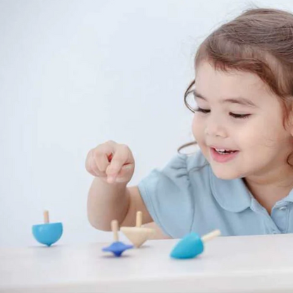ASSORTMENT OF WOODEN SPINNING TOPS