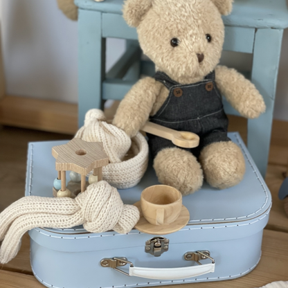 MORRIS AND HIS CLOTHES IN A SUITCASE 