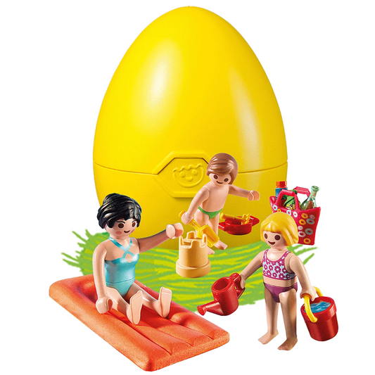 MOM AND CHILDREN AT THE BEACH