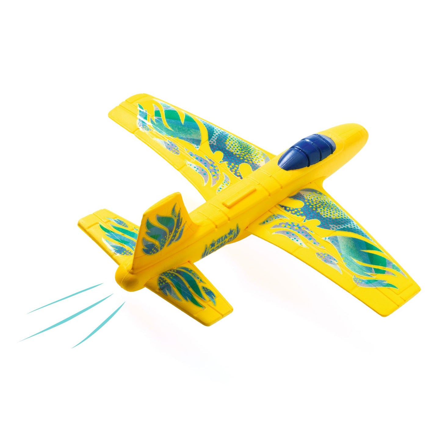 L'avion planeur en mousse Fire Jet de Djeco en plein vol, montrant ses ailes décorées de motifs bleus et verts.