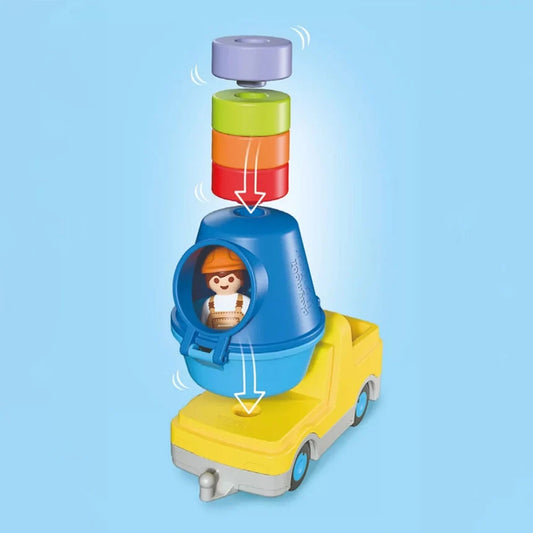 Schéma explicatif du camion bétonnière Playmobil Junior 72083 montrant le système d'insertion des blocs colorés dans la cuve.