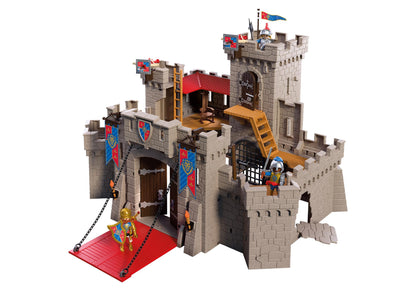 Vue rapprochée du château fort Playmobil mettant en avant le pont-levis fonctionnel, la prison à grille et le trône intérieur.