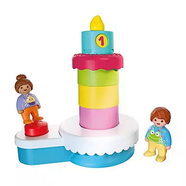 Jeu de gâteau d'anniversaire empilable Playmobil Junior 72086 assemblé avec bougie numérotée et deux figurines d'enfants.