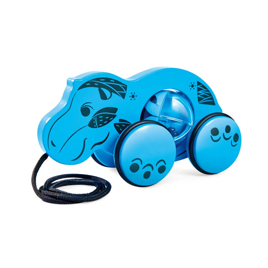 Jouet d'éveil à tirer bleu en forme d'hippopotame avec une corde noire et une bille rotative intégrée dans le corps.