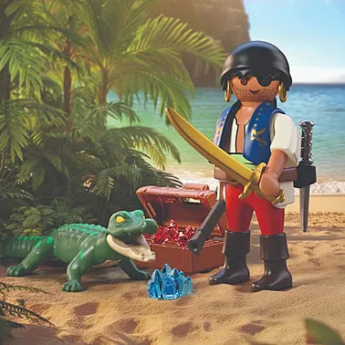 Figurine Playmobil Pirate armé d'un sabre doré protégeant son coffre au trésor face à un caïman sur une plage tropicale.