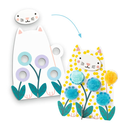 Démonstration du montage de la silhouette de chat du coffret Djeco avec la superposition de la tête et l'ajout de pompons colorés sur les fleurs.