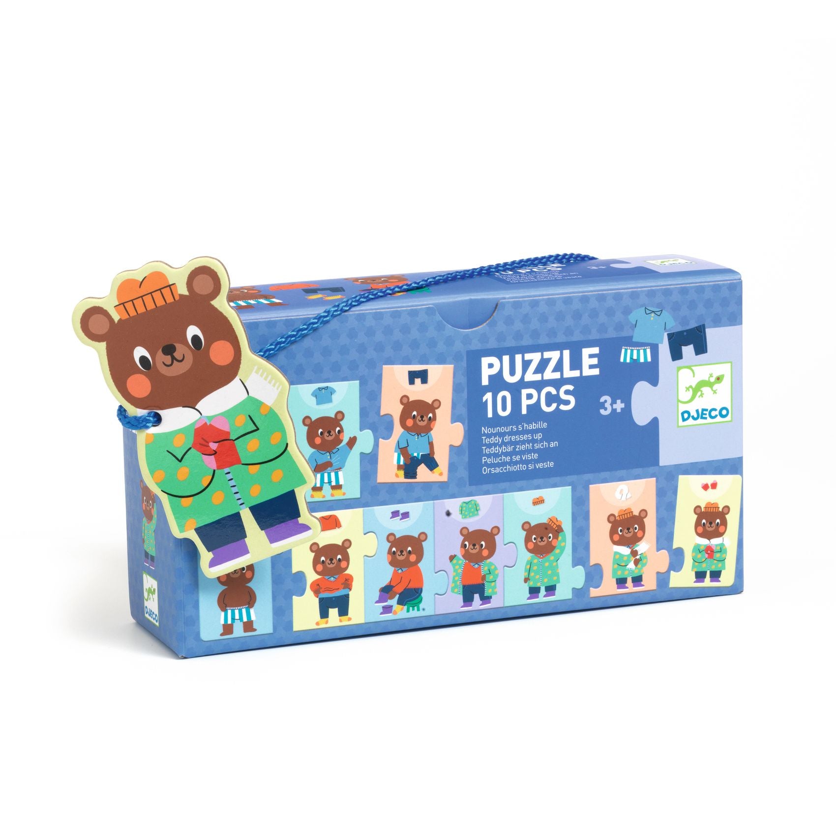 Boîte rectangulaire bleue du puzzle de 10 pièces Nounours s'habille de Djeco, munie d'une cordelette de transport et d'un médaillon en forme d'ours.