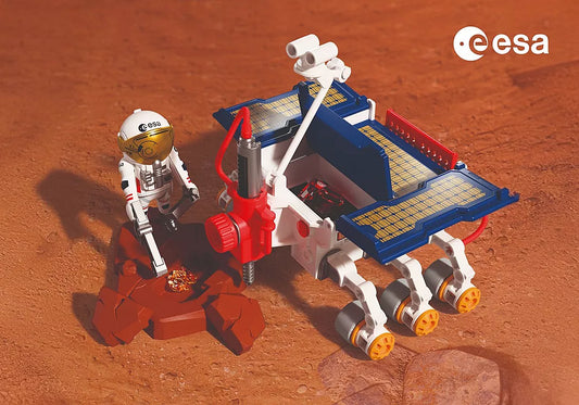 Scène d'exploration spatiale mettant en scène le Rover d'exploration sur Mars de l'ESA Playmobil 72012 et un astronaute analysant des cristaux sur le sol martien.