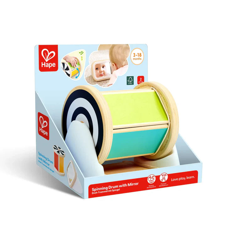 Boîte d'emballage d'origine du jouet éducatif Tambour rotatif avec miroir de la marque Hape, conçu pour les bébés de 3 à 18 mois.